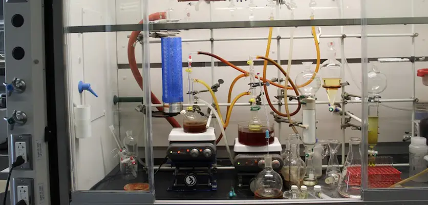 The reaction runs in a fume hood with controlled conditions
